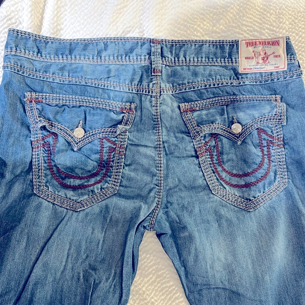 Worn one time a pair of men’s true religion, jeans, burgundy stitching